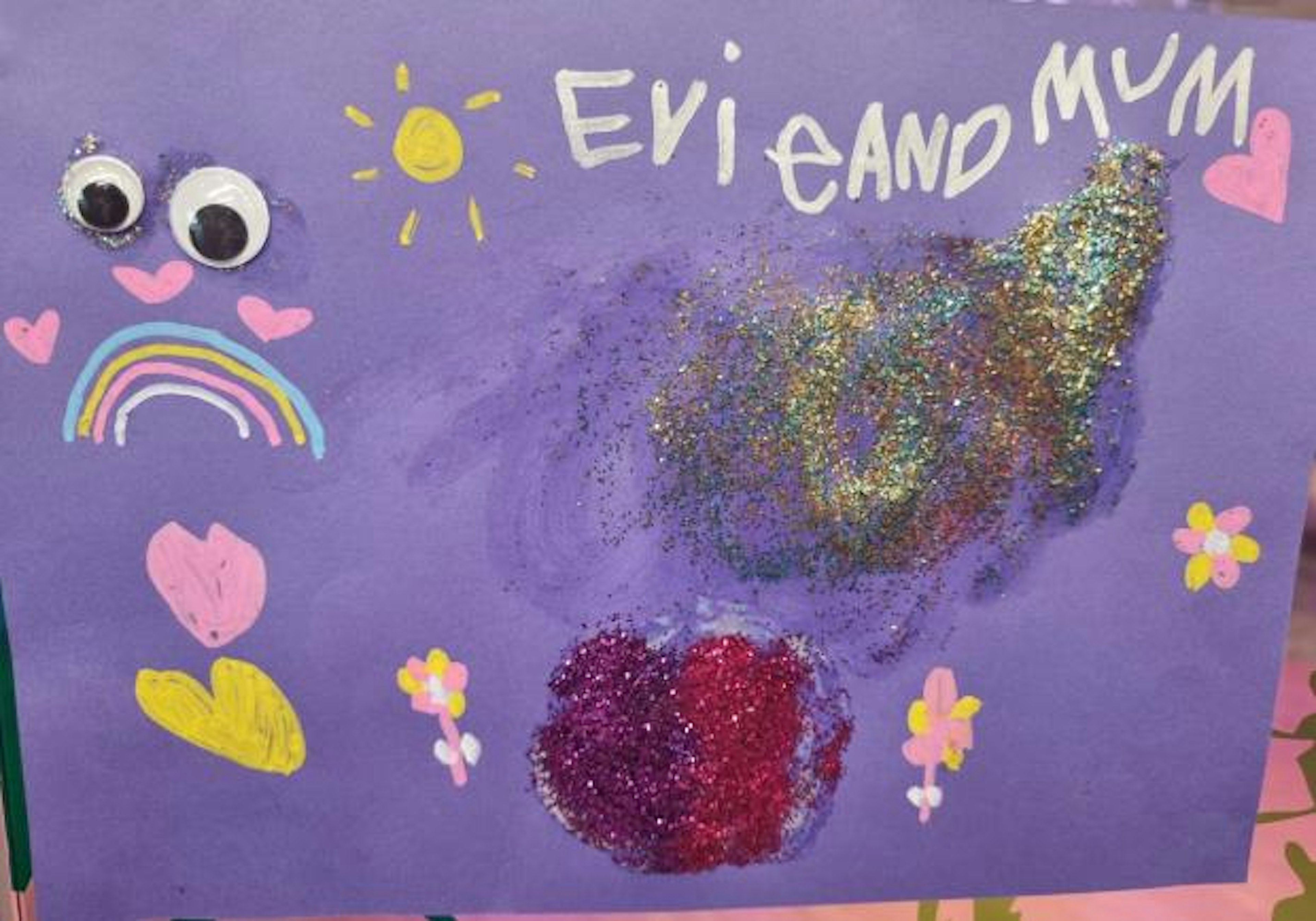 Sparkles, rainbow, love hearts and flowers. Purple,pink, gold and green glitter